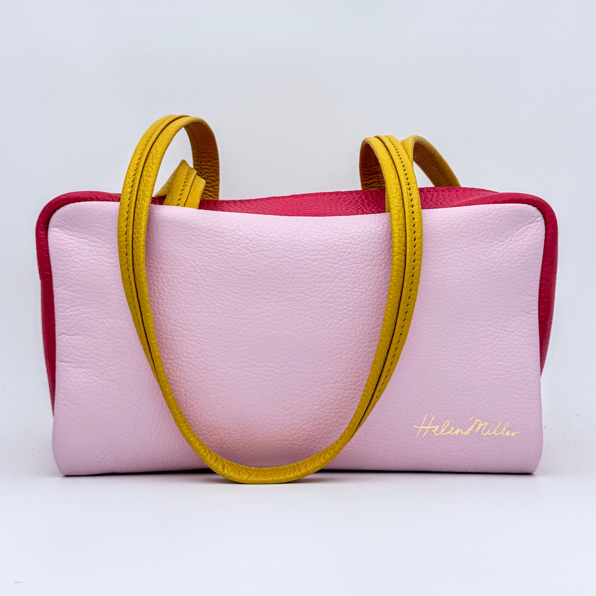 Lilac leather bag with cherry red gusset and lemon drop handles made in new zealand